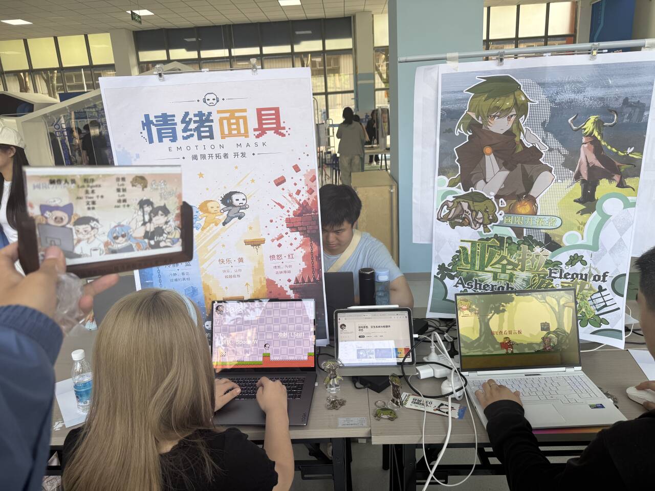 Players trying both games at the booth